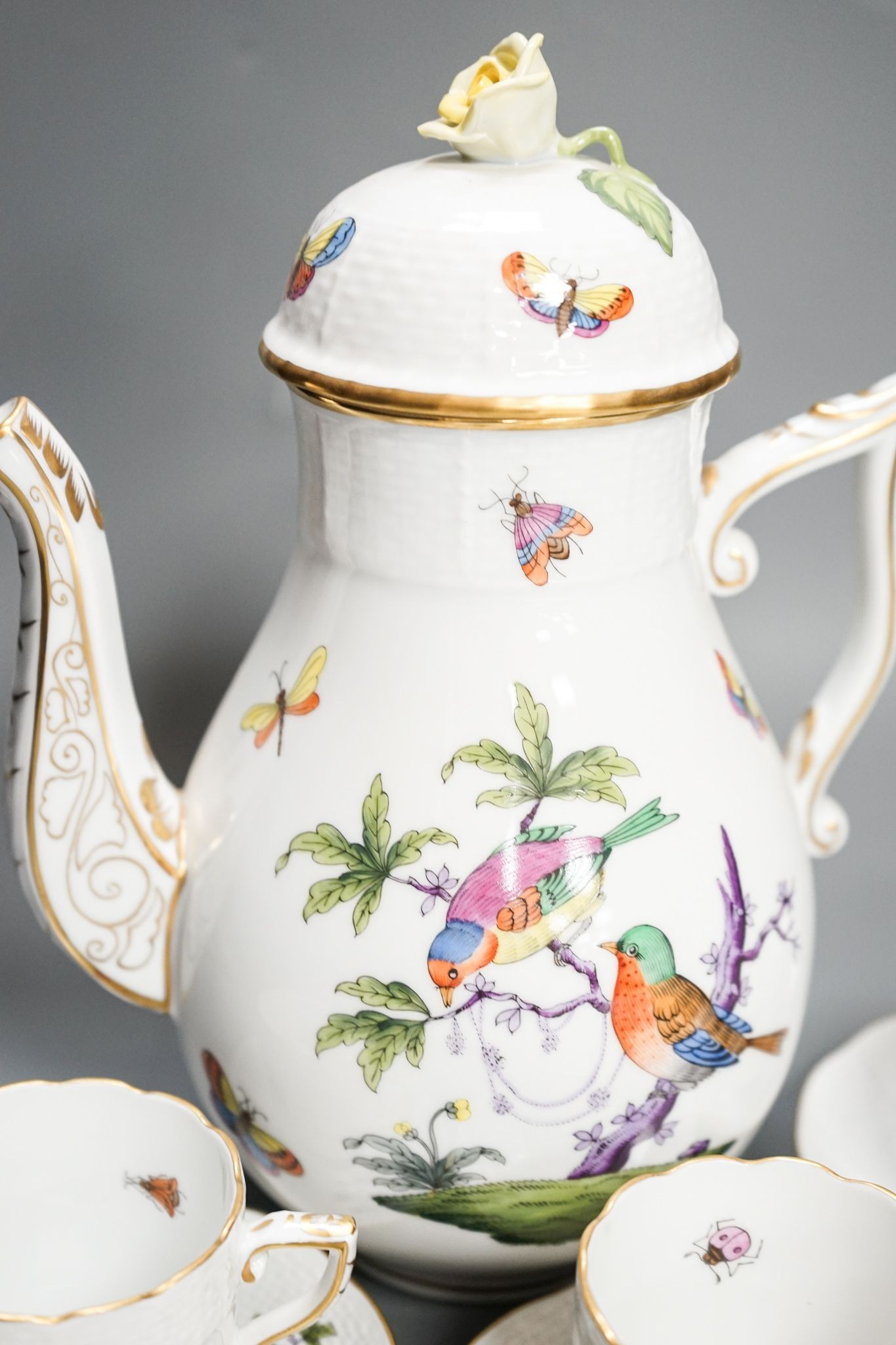 A Herend Rothschild birds pattern coffee pot and cover and eight coffee cups and five saucers